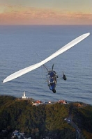 Soar over the lighthouse and Cape Byron by microlight